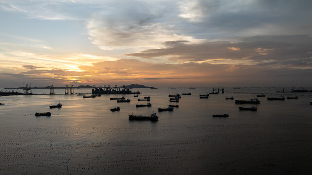 Aerial view oil and gas tanker ship offshore parking in sea, Crude oil tanker ship and LPG tanker ship offshore in bay at sunset, Silhouette oil and gas tanker ship.