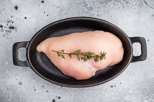 Raw white meat cuts, showcasing their natural shape and quality. A staple ingredient for countless delicious dishes in any kitchen. grey background. top view