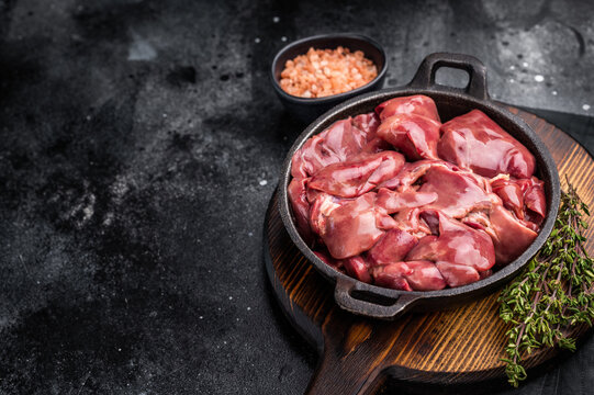 Vibrant raw chicken liver, perfect giblets  for those seeking a protein-rich addition to their meals.black background. top view
