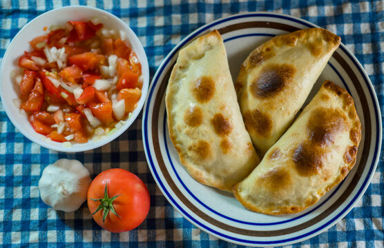 Chilean empanadas served with pebre tomato salsa for independence day celebration