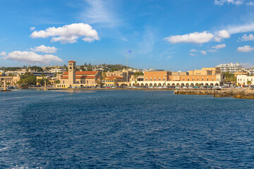 Obraz premium Rhodes Greece Two deer at Mandraki harbor, Rhodes old town with view at Holy Metropolis of Rhodes church