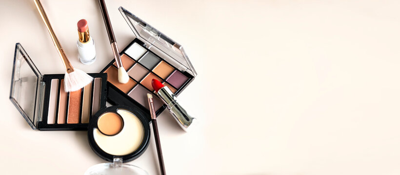 Cosmetics set closeup, makeup items collection, beauty products arrangement closeup empty space background.