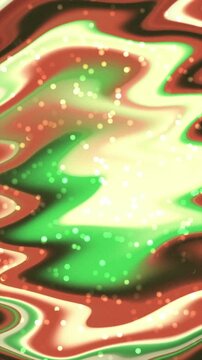 Abstract liquid background with flowing red and green colors and sparkling light particles.