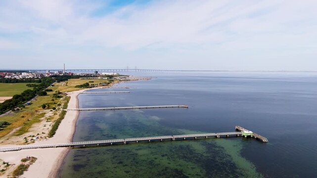 Drone view of Jetties at Ribersborg beach, &Ouml;resund bridge and buildings