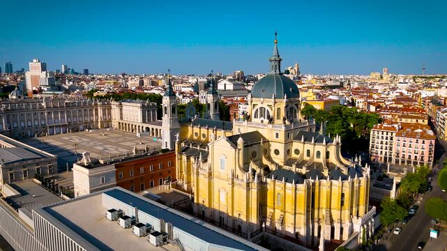 Almudena Cathedral and Royal Palace dominate Madrid city center under clear daylight; ideal for Spain travel, tourism, architecture and destination advertising