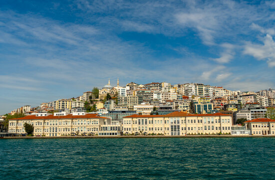 Panoramic view of Istanbul cityscape with historic buildings and mosques overlooking the Bosphorus strait under a bright blue sky