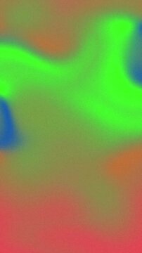 Abstract blurred background with vibrant green blue and red color gradients.