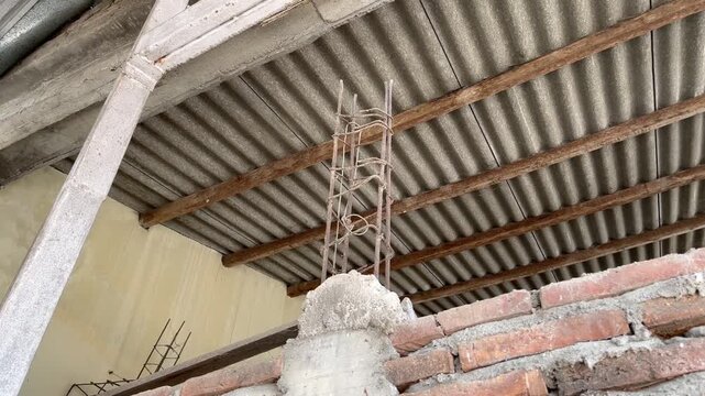 Low angle view of steel rebar column in residential house construction