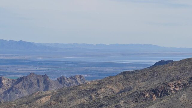 Long view of the north end of the Salton Sea as seen from the Coachella Valley Vista Point in Palm Desert, located in Riverside County in the Colorado desert in southern California.