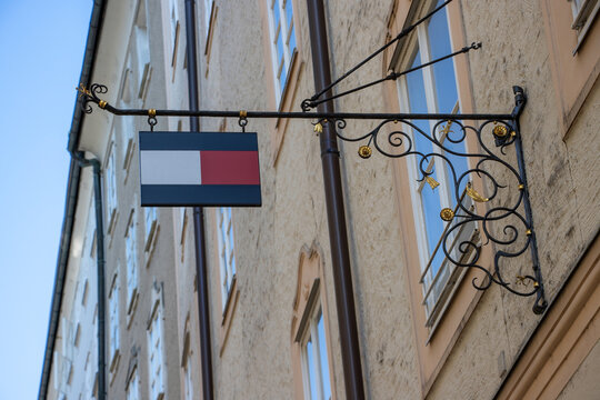 Tommy Hilfiger sign on a street in Salzburg, Austria. Tommy Hilfiger is an American clothing brand.