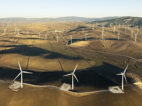 Windmills on a wind farm near Zahara de los Atunes. Aerial view. Drone shot. C&aacute;diz province, Andalusia, Spain