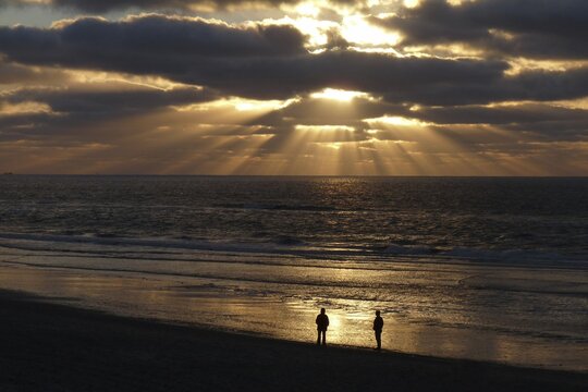 Two people on the seashore, evening mood, Texel Island, North Holland, Netherlands