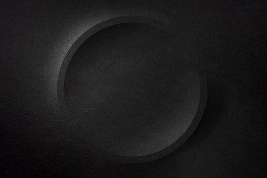 Dark black paper texture background with circular element and copy space for banner template advertising and graphic design