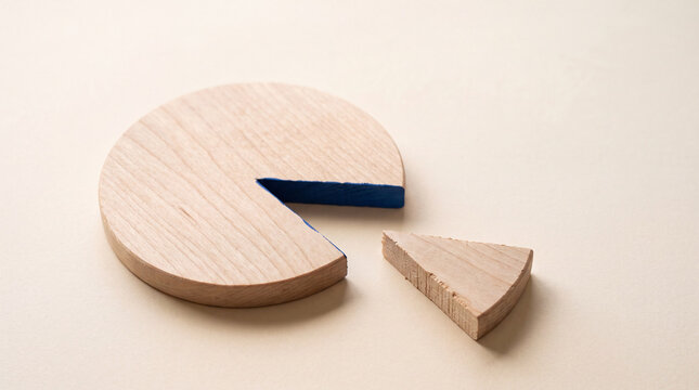 Wooden pie chart with missing slice symbolizing data gap or incomplete analysis on neutral background