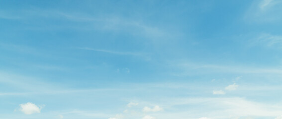 Fototapeta premium the sky is clear blue with fluffy white clouds, the sky is very bright, and the sun shines.