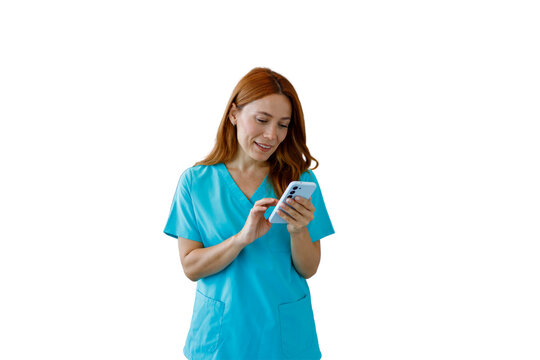 Nurse in scrubs using smartphone smiling