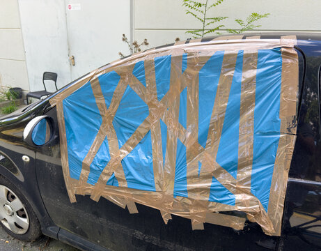 Smashed Car Window After Vandalism &ndash; Vehicle Damage, Crime and Insurance Concept