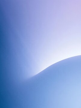 Close-up of a curved surface in a light blue color. the surface appears to be smooth and smooth, with a slight curve on the right side.