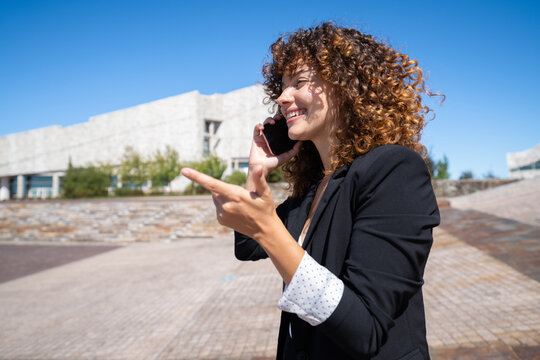 Businesswoman talking on phone outdoors