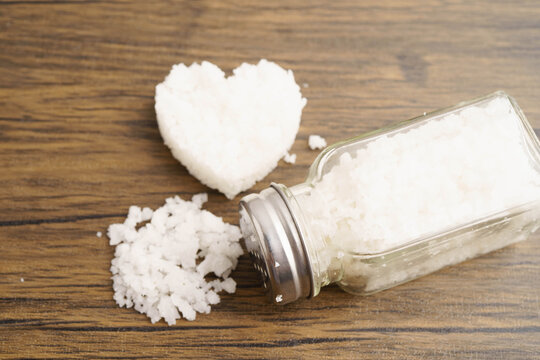 Sodium chloride sea salt with salt shaker.