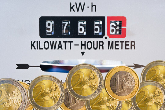 Electricity meter with gold coins energy cost.