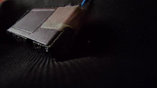 Close-up View of a Projector Hardware Replacement Module Wrapped in Protective Tape for Maintenance  Repair Concept