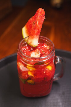 Refreshing and colorful healthy cool drinks served with fresh lemon slices and watermelon garnish. A vibrant summer beverage concept representing freshness, hydration, natural ingredients, healthy lif