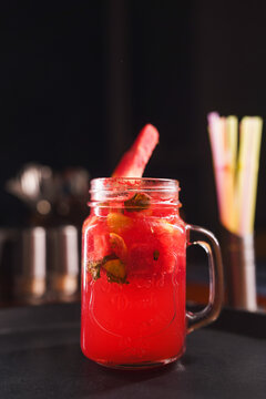 Refreshing and colorful healthy cool drinks served with fresh lemon slices and watermelon garnish. A vibrant summer beverage concept representing freshness, hydration, natural ingredients, healthy lif
