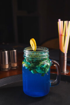 Refreshing and colorful healthy cool drinks served with fresh lemon slices and watermelon garnish. A vibrant summer beverage concept representing freshness, hydration, natural ingredients, healthy lif