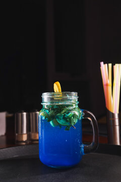 Refreshing and colorful healthy cool drinks served with fresh lemon slices and watermelon garnish. A vibrant summer beverage concept representing freshness, hydration, natural ingredients, healthy lif