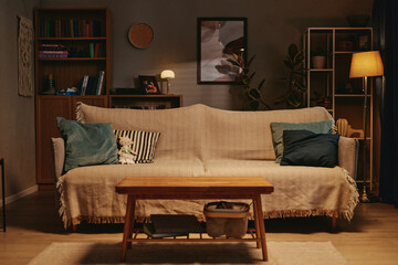 Empty living room featuring sofa, coffee table and home decor indoors. Suitable for real estate advertising, home staging promotions and interior design campaigns © Seventyfour