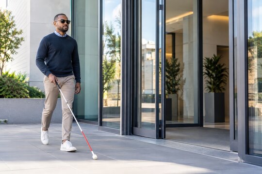 Visually impaired commuter approaching an accessible office