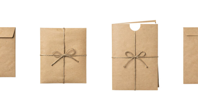 Set of brown kraft paper envelopes and folders tied with natural jute twine bows on a white surface isolated on a transparent background