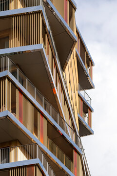 Contemporary apartment building with balconies and wooden facade in a residential area of Paris France showing contemporary apartment architecture