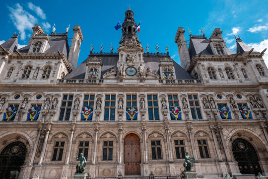 H&ocirc;tel de ville in paris, france, showing the intricate neo-renaissance facade and clock tower against a blue sky
