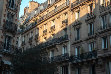 Obraz premium Parisian haussmann architecture with balconies and classic facades, capturing the charm of urban living in paris, france