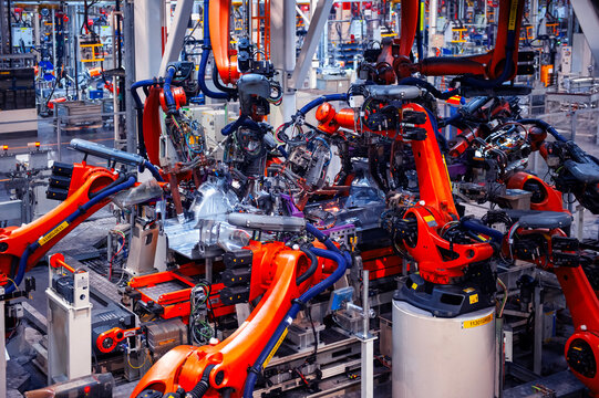 Automated welding robotic arm for automotive factory assembly lines