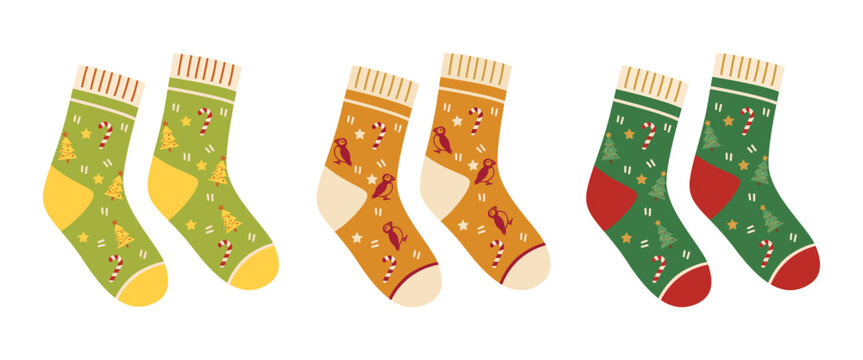 Cute Christmas socks set with festive tree, candy cane, and bird patterns isolated on white background. Winter holiday warm socks flat illustration.