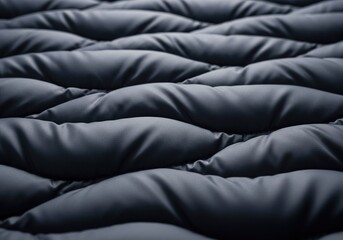 Obraz premium Abstract texture of dark grey quilted fabric material.
