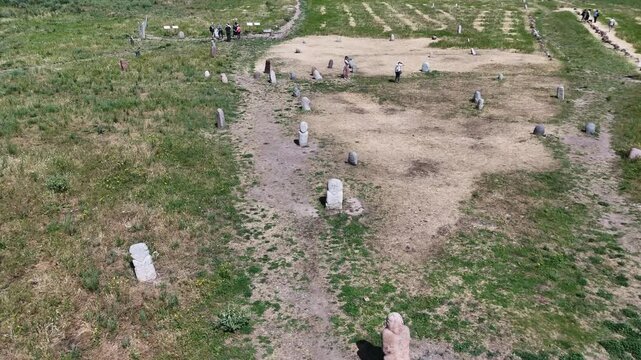Stone garden or field of ancient Turkic stone statues (balbals) near Burana tower in Kyrgyzstan.