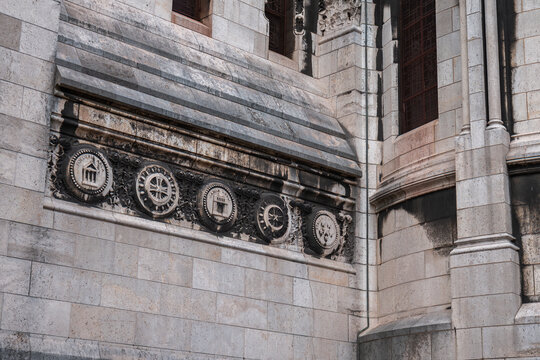 Sacre coeur basilica wall carvings in paris, france, showcasing stone architecture details and religious symbolism