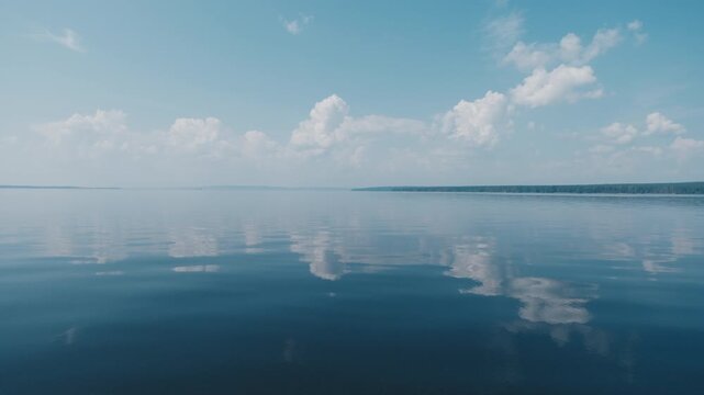 Calm lake surface during sunny summer day