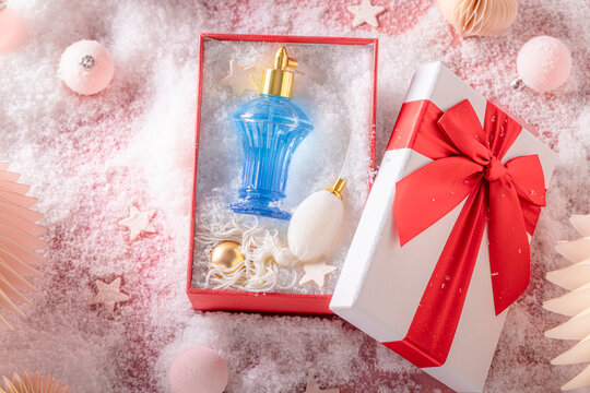 Fine perfume comes packaged neatly in custom Christmas gift box.