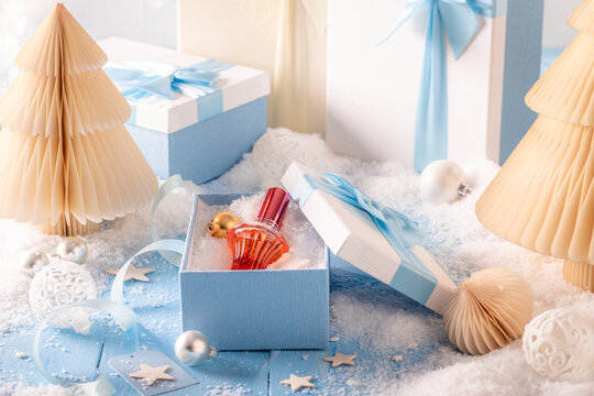 Fine perfume sits quietly right near the Christmas tree decorations.