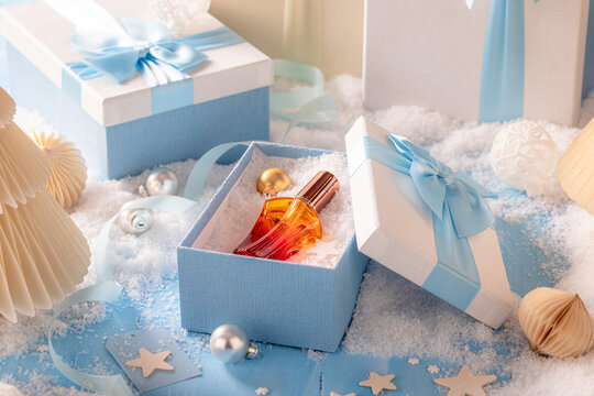 Special perfume is wrapped up tightly in Christmas gift box.