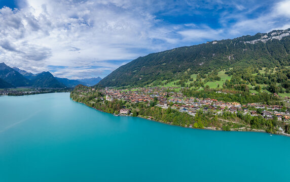 Aerial view of Ringgenberg Castle and Ruin overlooking the turquoise waters of Lake Brienz with the village nestled against lush mountains Ringgenberg, Canton of Bern, Switzerland.