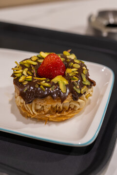 Gourmet Paris-Brest choux pastry filled with cream and fresh strawberries