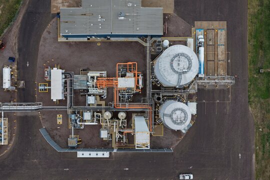Aerial view of an industrial facility featuring large storage tanks, intricate piping systems, and processing equipment in Englewood, Colorado, United States.