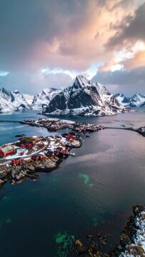 Serene Arctic Village Nestled Amidst Snow-Capped Mountains and Tranquil Waters
