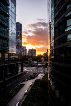 Sunset between office towers above a street in La Defense district of Paris France showing contemporary urban business architecture